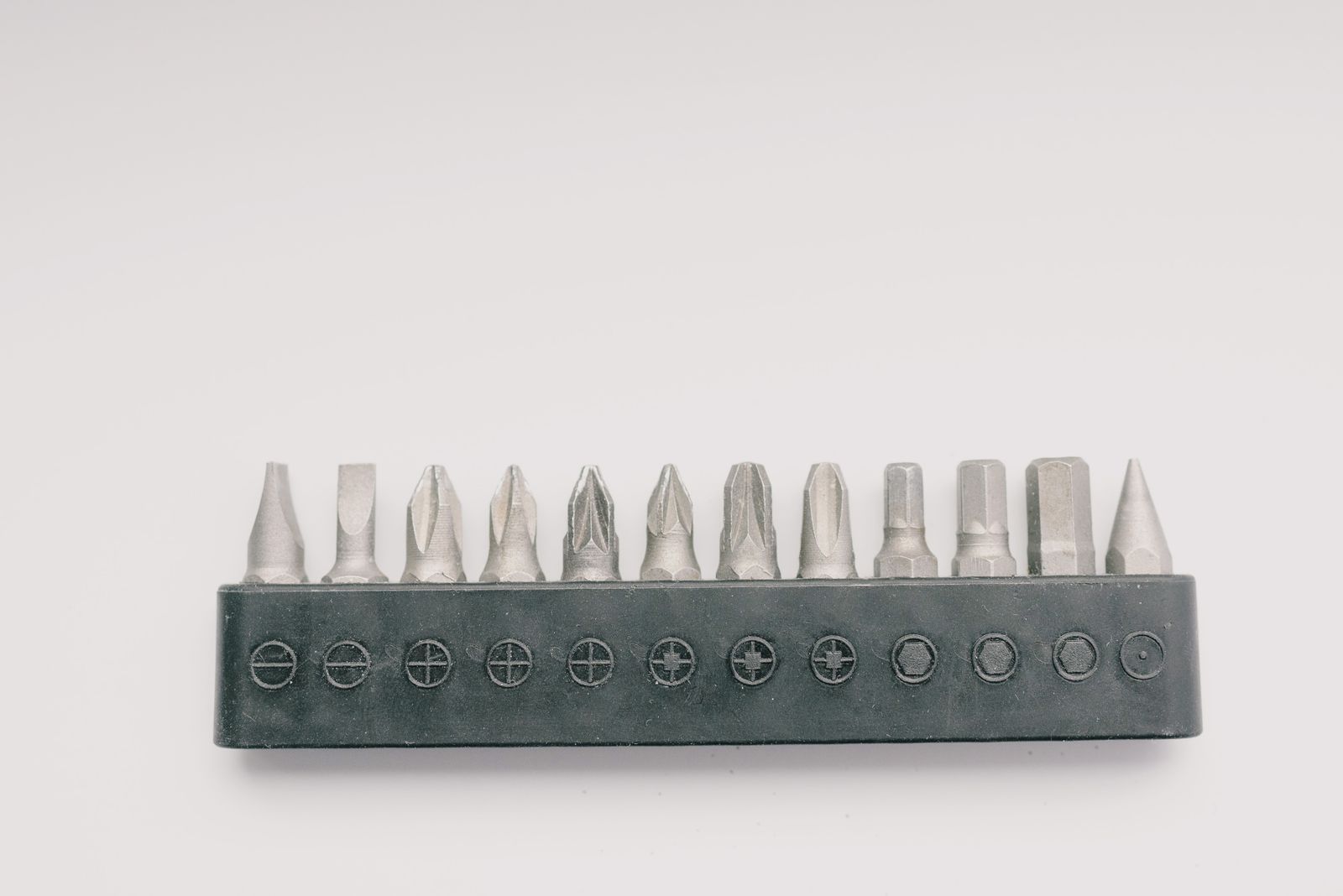 A clean set of screwdriver bits laid out for a handyman job